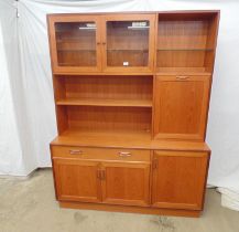 G-Plan teak wall unit having two door glazed cabinet with glass shelf over, fall front drinks