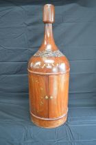 Hardwood table top drinks cabinet in the form of a Magnum bottle with brass inlay and carved