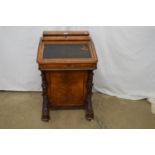 Victorian walnut Davenport desk the front lifting to reveal fitted drawers over a bank of four right