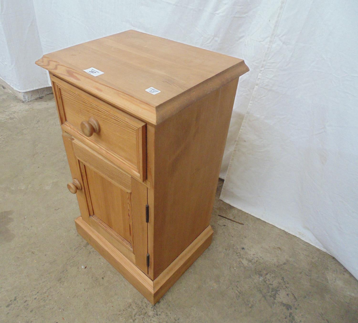 Modern pine bedside cupboard having a single drawer over cupboard base, standing on a plinth - Image 3 of 3