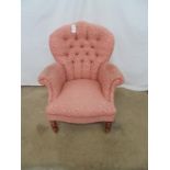 button back bedroom chair in pink upholstery having scrolled arms and shaped seat, standing on