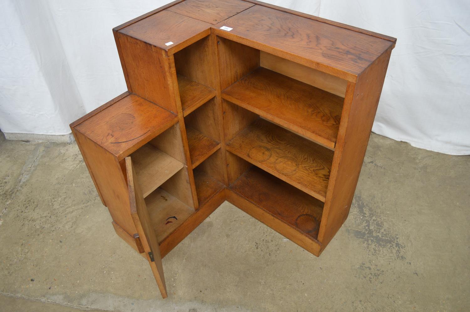 Oak corner bookcase having four fixed shelves and single cupboard door enclosing single shelf - 74cm - Image 3 of 3