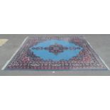 Blue ground carpet having black, red and white pattern with end tassels - 3.95m x 3m Please note