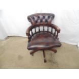 Reproduction Captains chair having buttoned leather back with padded seats and arms turned