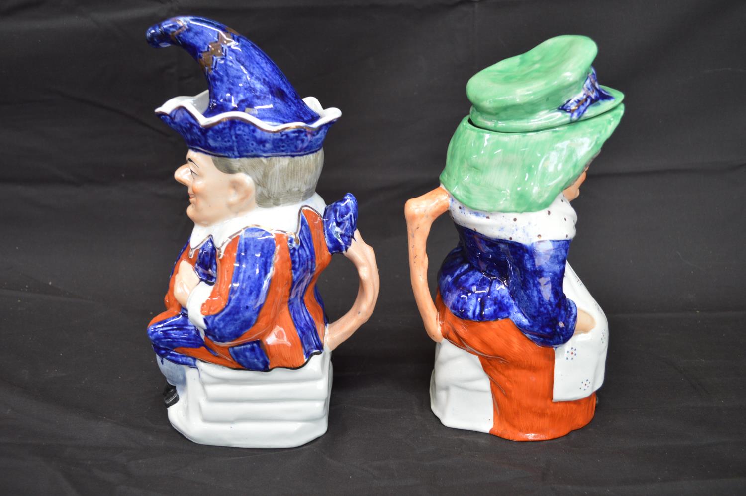Pair of Staffordshire Toby jugs in the form of Punch and Judy complete with hat formed lids - 28cm - Image 5 of 5