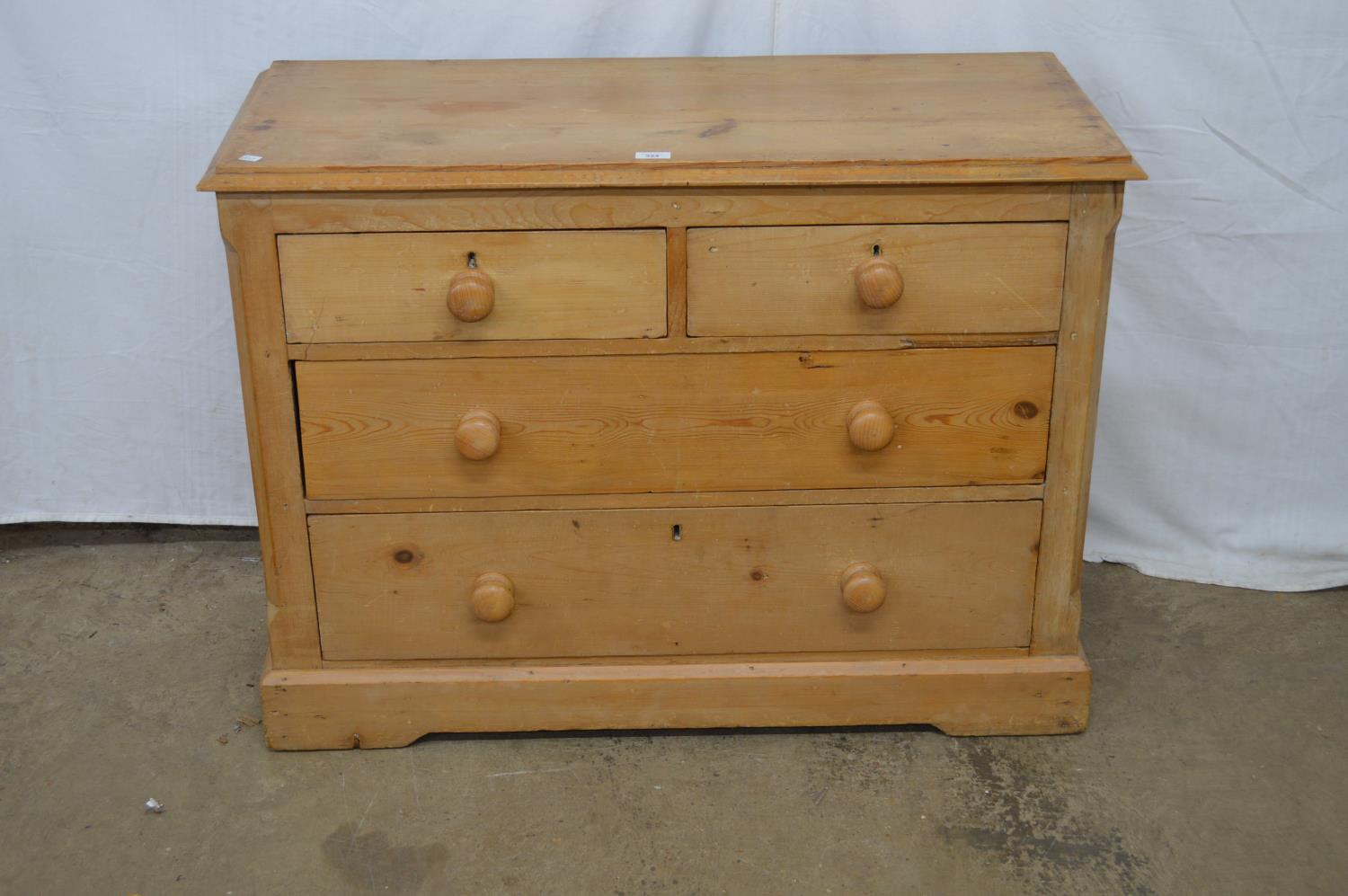 Victorian pine chest of two short and two long drawers with turned knob handles, the top having
