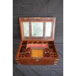 Brass bound and inlaid mahogany vanity travelling box opening to reveal fitted interior and mirror