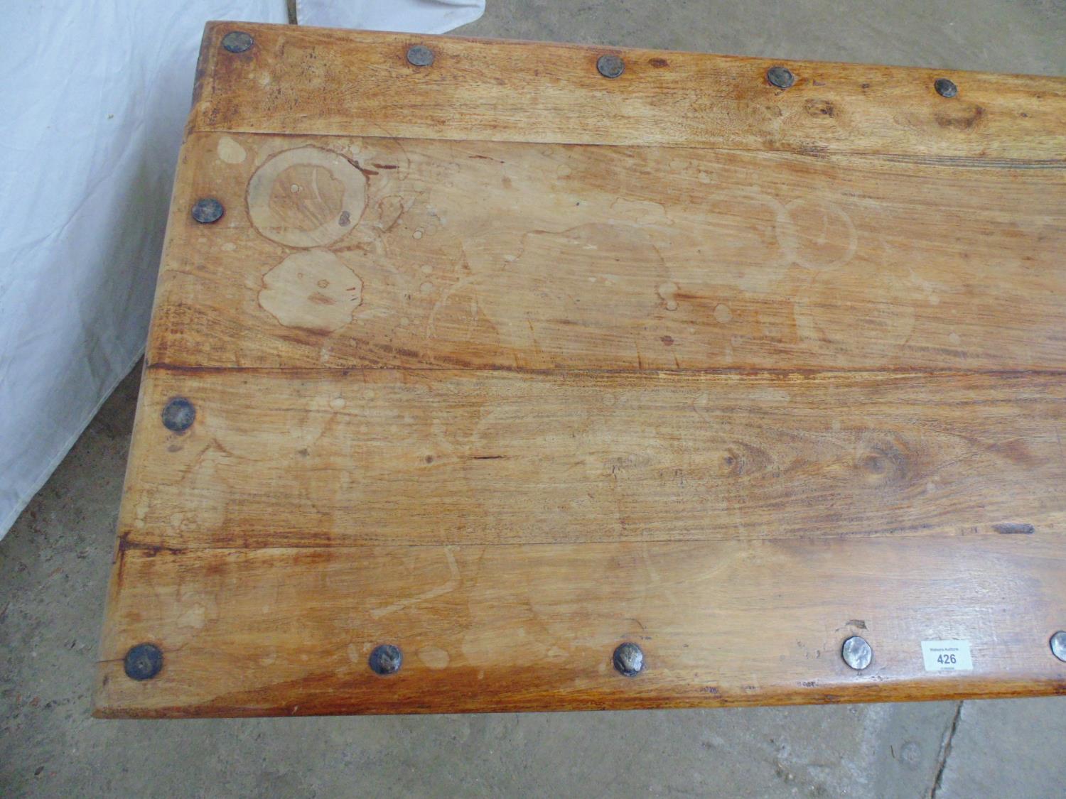 Hardwood coffee table having metal banding and studwork decoration, standing on turned bottle - Image 3 of 5