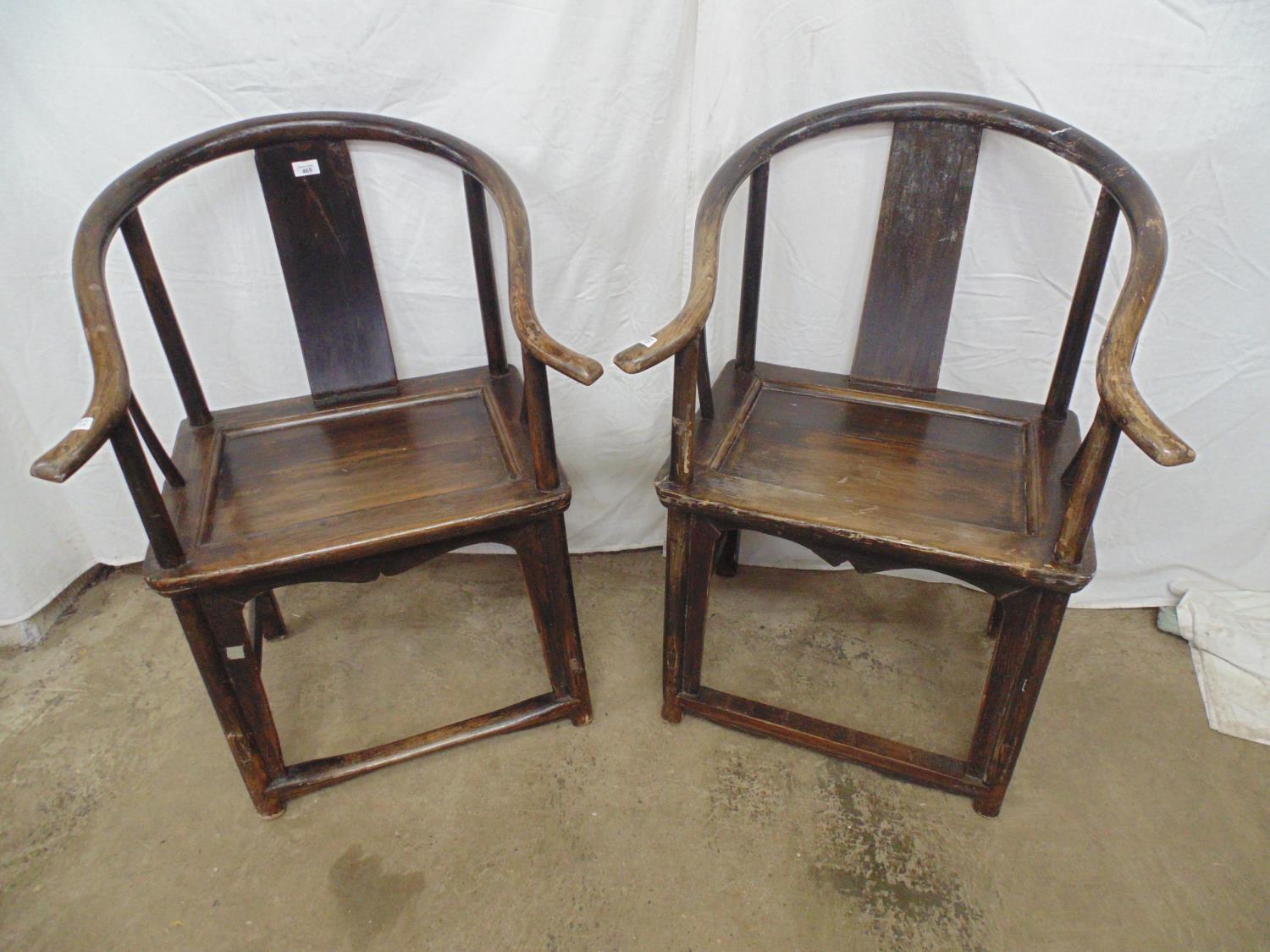 Pair of Oriental style horseshoe back armchairs with solid back splat, curved apron over stepped