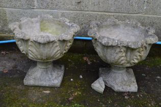Pair of acanthus/cabbage leaf formed urns standing on square bases - 48.5cm x 41cm tall (one base