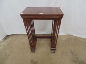 Mahogany nest of four rectangular top tables, standing on elegant turned legs ending in out swept
