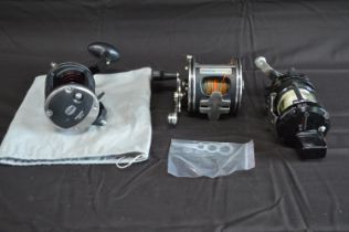 Group of three Penn fishing reels to comprise: Defiance 25LW, Commander and 113 4/0 Senator Please