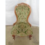 Showwood frame button back bedroom chair in green patterned upholstery, standing on shaped front
