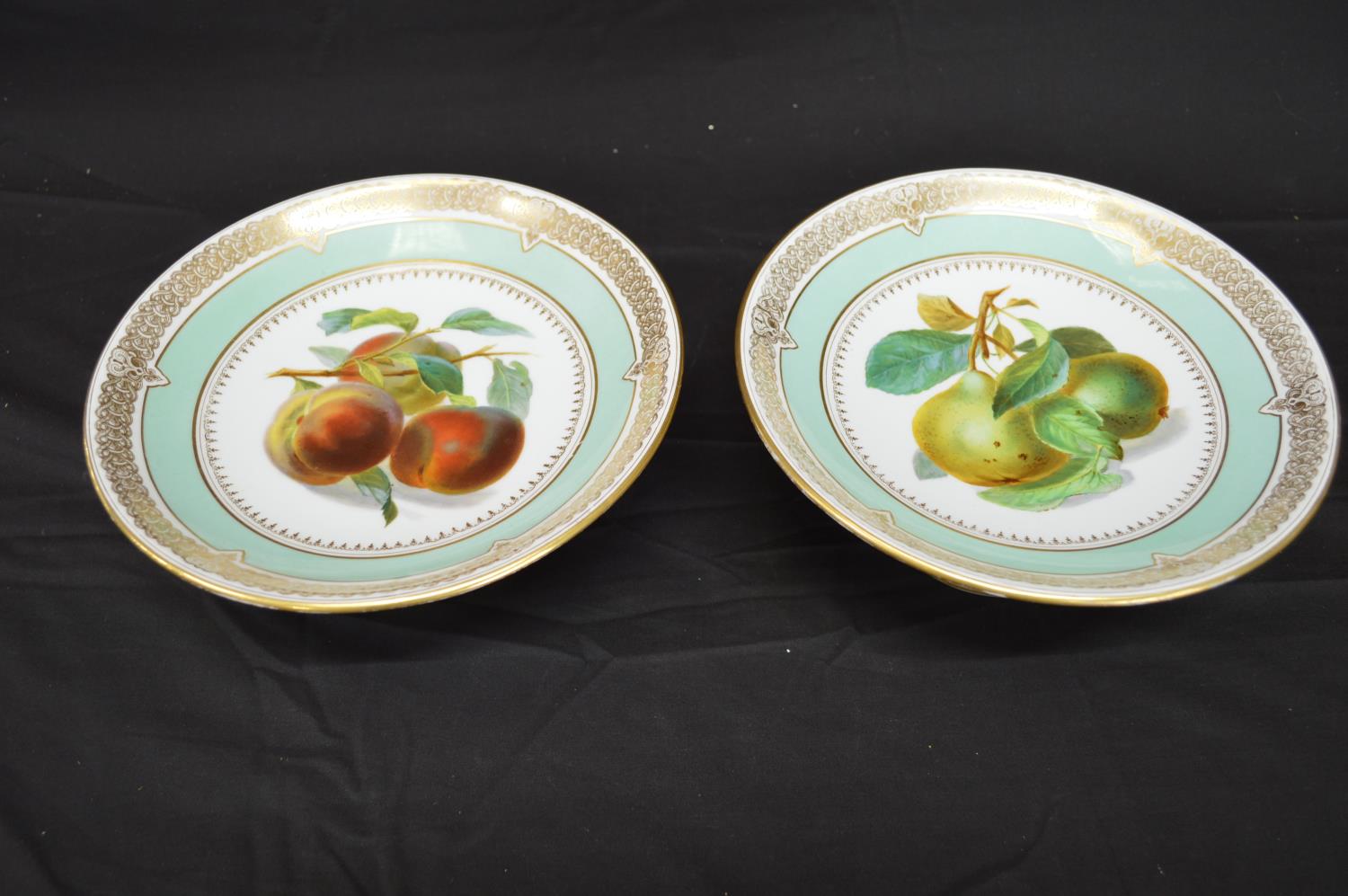 Pair of Continental porcelain tazza's each decorated with central panel of fruit with pale green and