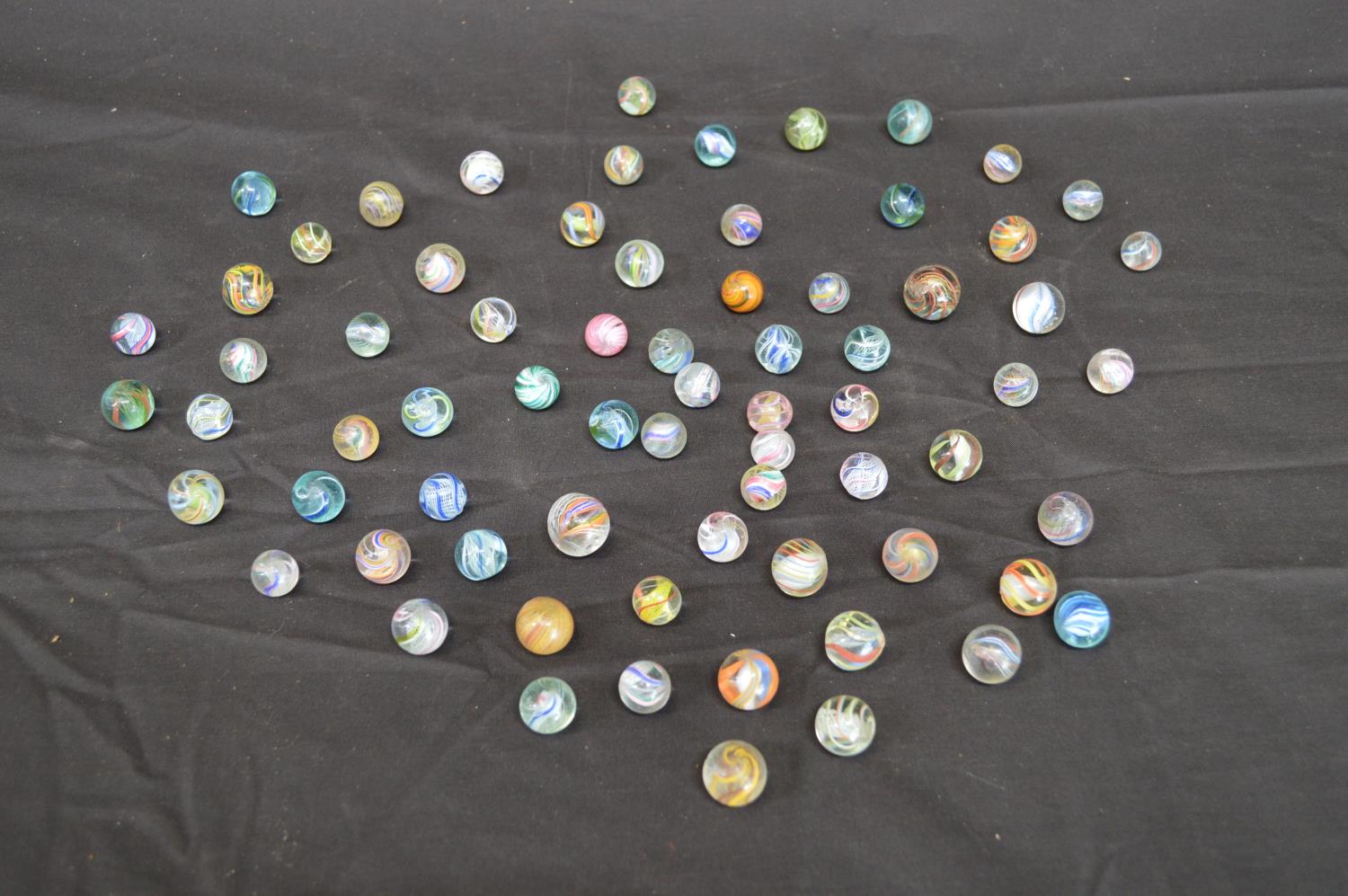 Collection of seventy vintage lattice and onion skin marbles Please note descriptions are not