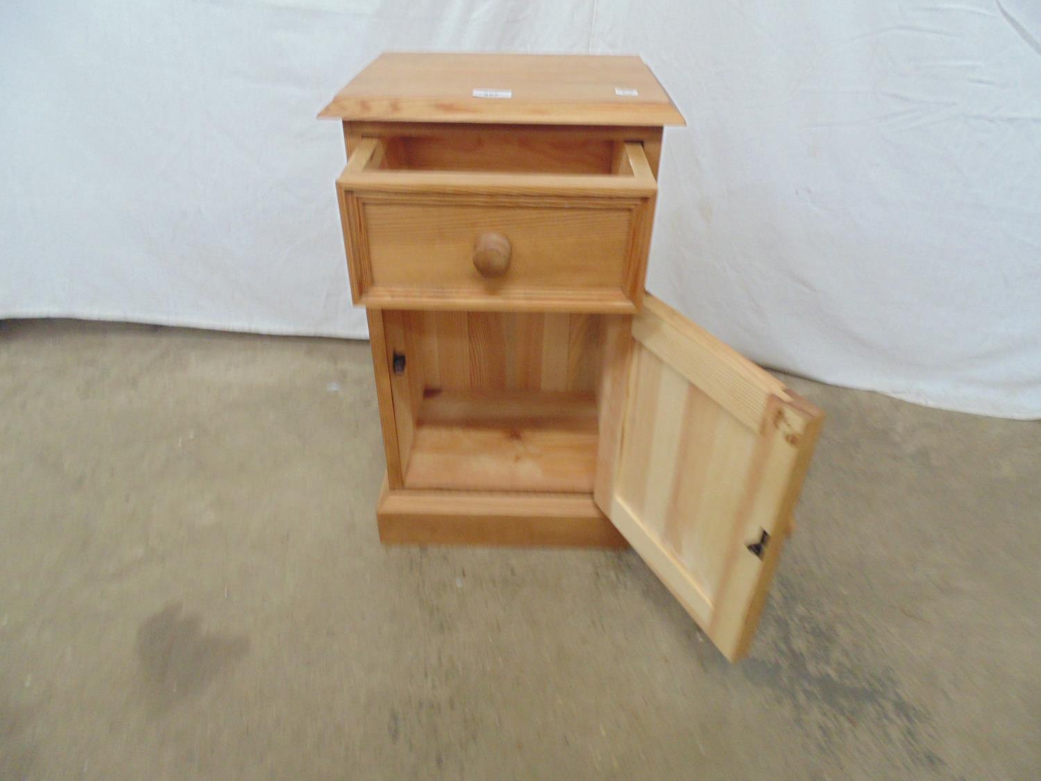 Modern pine bedside cupboard having a single drawer over cupboard base, standing on a plinth - Image 2 of 3