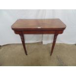 Inlaid mahogany card table having green baized playing surface over four turned legs ending in