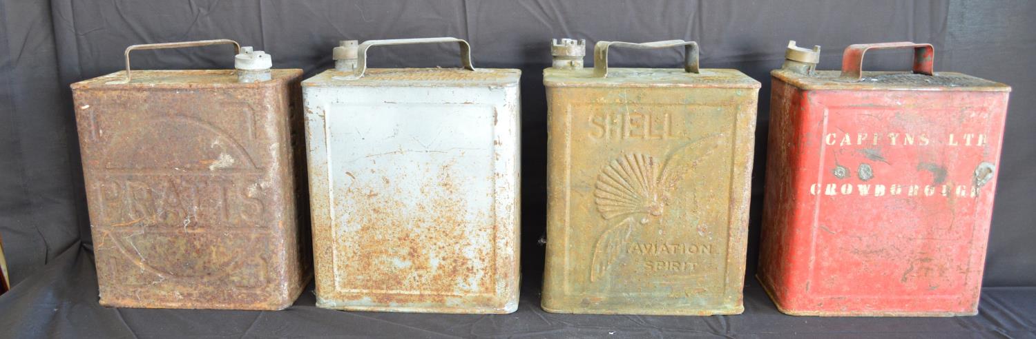 Group of four vintage square unrestored petrol cans to include: Pratts with un-named lid, Shell