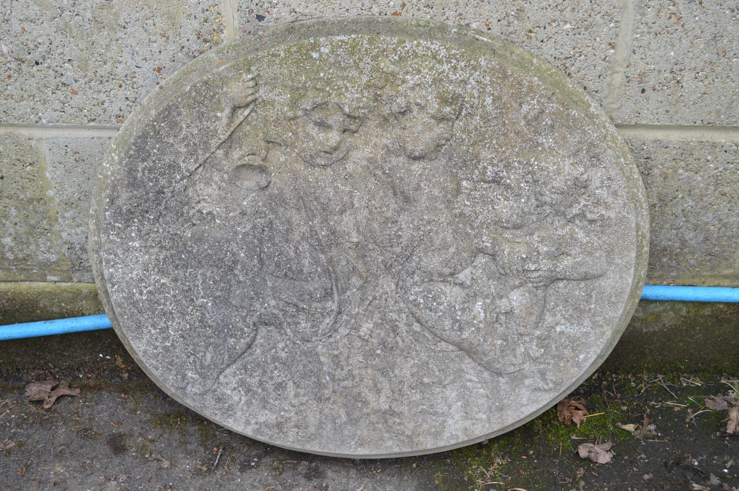 Oval wall plaque decorated with three cherubs - 68cm x 59cm tall Please note descriptions are not