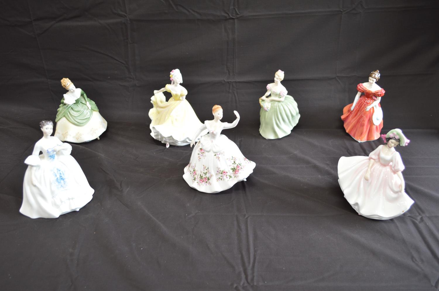 Group of seven Royal Doulton figures to comprise: Soiree HN2312, Winsome HN2220, Clarissa HN2345,