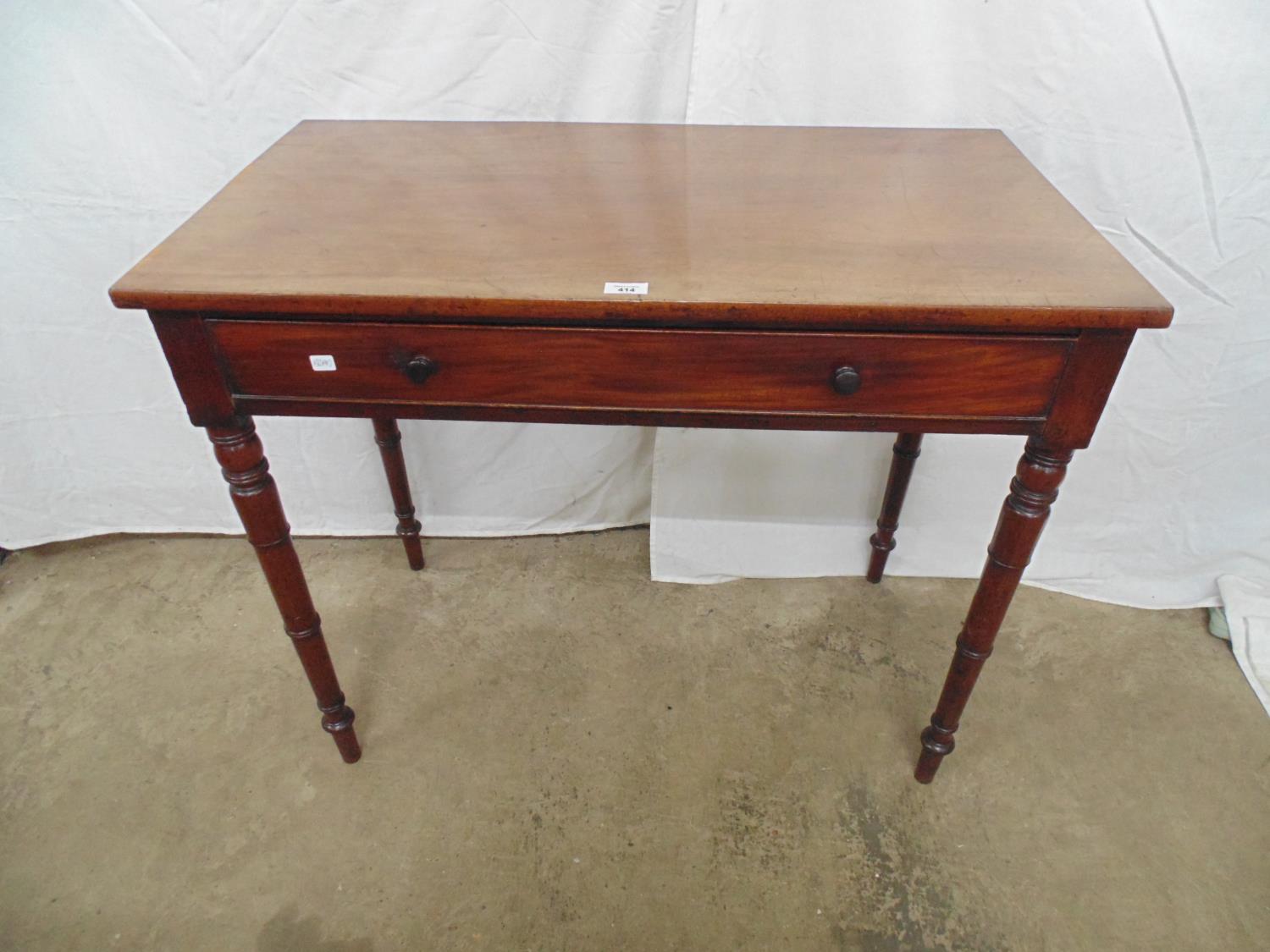 Mahogany side table having one long drawer, standing on turned legs - 94cm x 51cm x 79cm tall Please