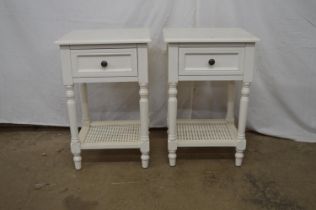 Pair of painted modern bedside tables having single drawers supported on turned columns leading to