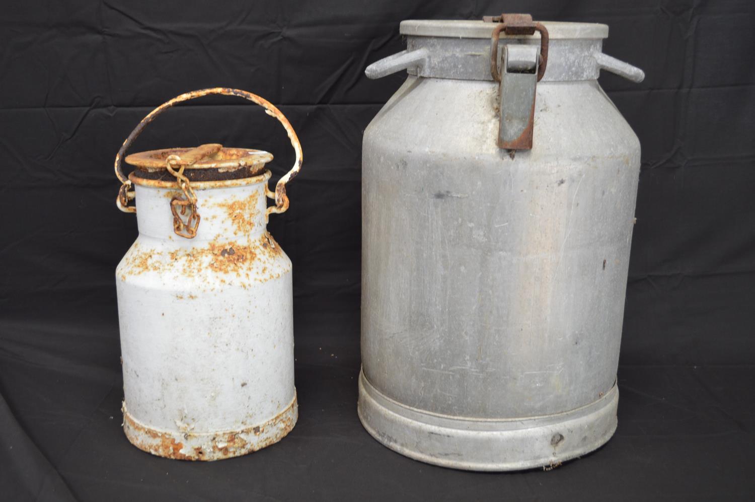 Aluminium milk churn with lid - 53cm tall together with a smaller painted milk churn with lid Please