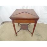 Mahogany inlaid and cross banded two tier envelope card table the top opening to green baize with
