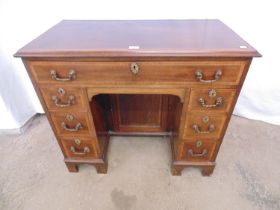 Mahogany inlaid cross banded dog kennel desk having one long drawer over central kneehole cupboard
