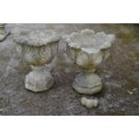 Pair of acanthus/cabbage leaf formed urns standing on octagonal formed bases - 48cm x 60cm tall (one