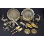 Collection of brassware to include: two circular trays, canon, pair of oak handled scoops and