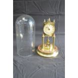 Dome cased brass Anniversary clock having cream dial with black numerals and black hands - 31.5cm