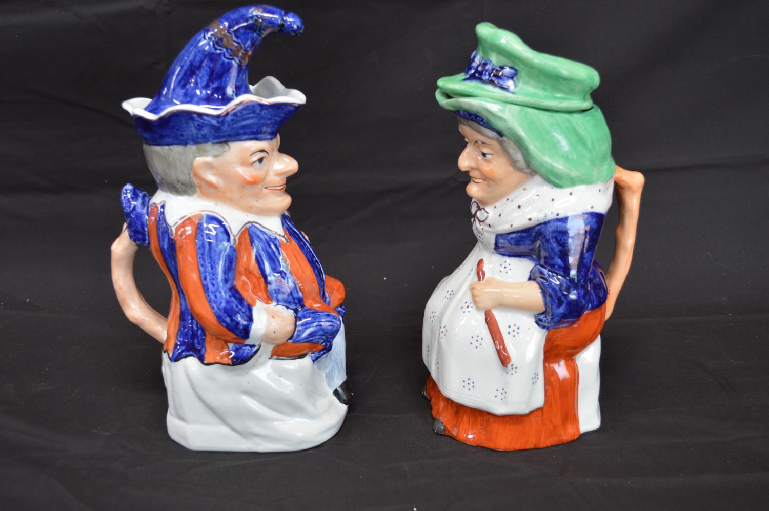 Pair of Staffordshire Toby jugs in the form of Punch and Judy complete with hat formed lids - 28cm - Image 3 of 5