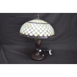 20th century Tiffany style table lamp having urn formed column on a circular base - 53cm tall Please