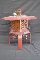 Painted iron floor standing pagoda formed lamp, standing on four flat legs - 51cm x 55cm tall Please