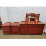 Modern mahogany chest of drawers having an arrangement of seven drawers, standing on turned legs -