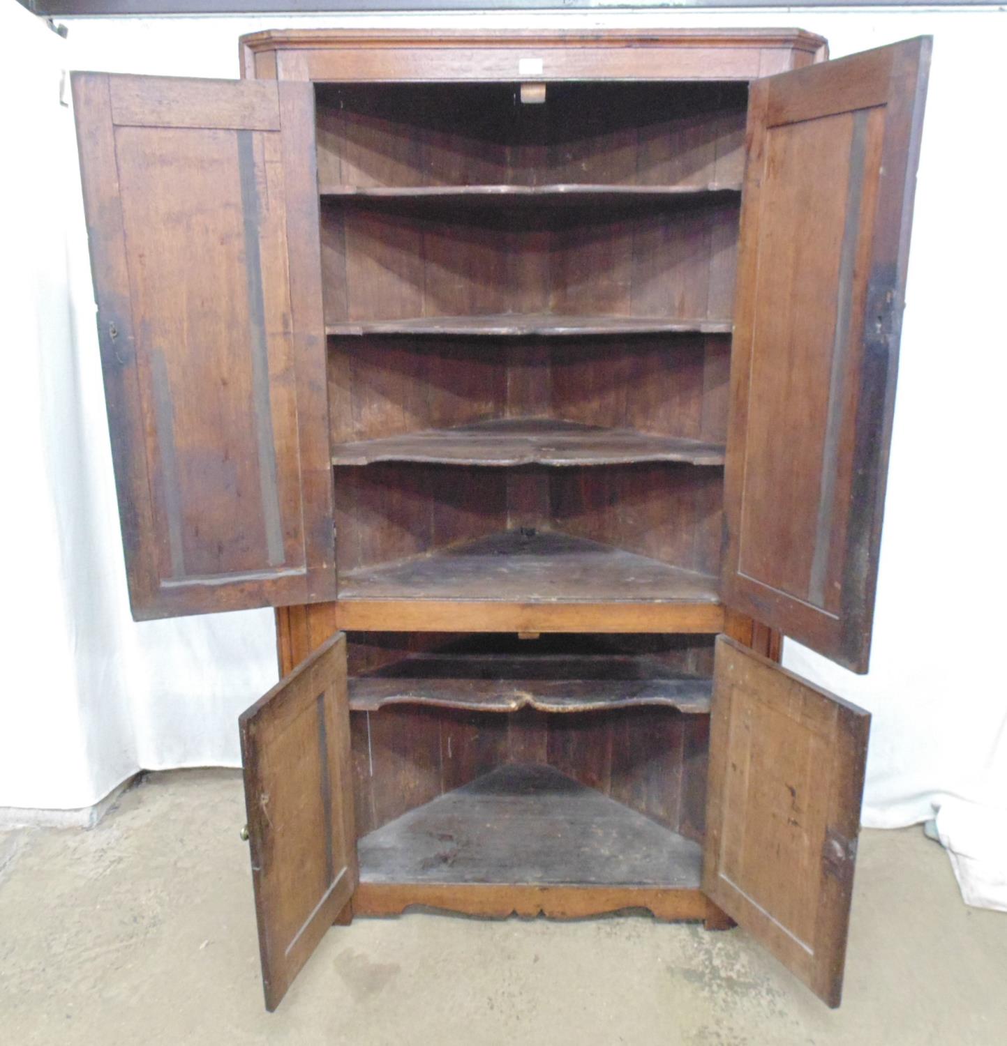 Oak corner cupboard having two large panelled doors and two small panelled doors opening to an - Image 2 of 3