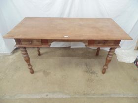 Hardwood desk having rectangular top over three drawers, standing on turned legs - 149cm x 49cm x