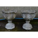 Pair of acanthus/cabbage leaf formed urns standing on octagonal formed bases - 48cm x 60cm tall
