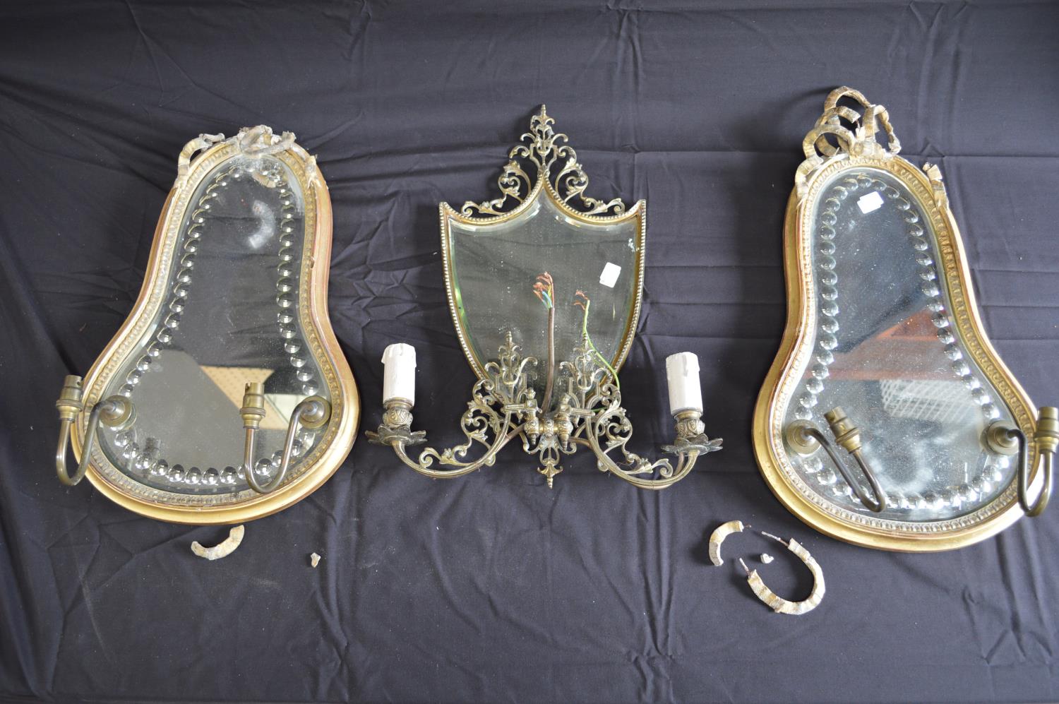 Pair of gilt framed girandoles each shaped mirror having two branch electric bulb holders - 30cm x