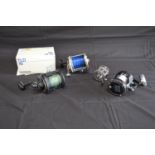 Group of four fishing reels to comprise: Shakespeare Leader No. 1909, Ugly Boat 2916 301, Shimano