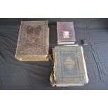 Two leather bound family Bibles together with the Copping Bible in a box and The Book Of Common