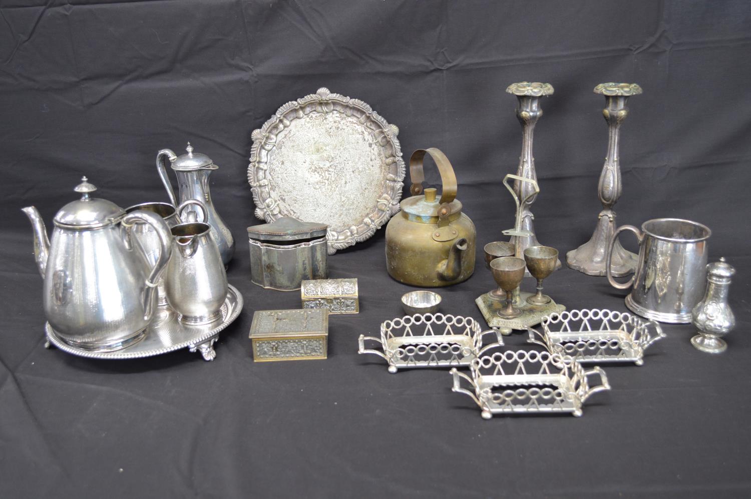 Collection of silverplate and metalware to include: four piece teaset, salver, pair of candlesticks,