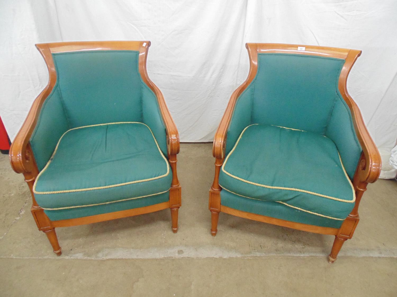 Pair of modern hardwood framed cane sided armchairs having scrolled cresting rail, padded seats