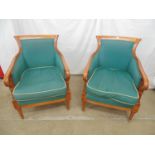 Pair of modern hardwood framed cane sided armchairs having scrolled cresting rail, padded seats