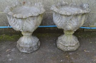 Pair of acanthus/cabbage leaf formed urns standing on octagonal formed basis - 48cm x 60cm tall