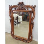 Bevelled edge mirror within ornate carved and pierced frame - 80cm x 127cm Please note