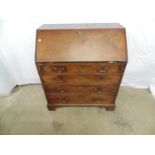Mahogany bureau the fall front opening to pigeon holes over four graduated drawers with swan neck