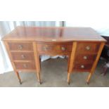 Mahogany inlaid bow fronted kneehole writing desk having red leather insert with gilt tooling over