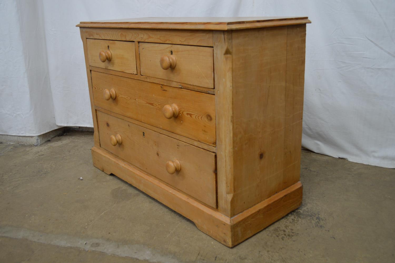 Victorian pine chest of two short and two long drawers with turned knob handles, the top having - Image 3 of 4